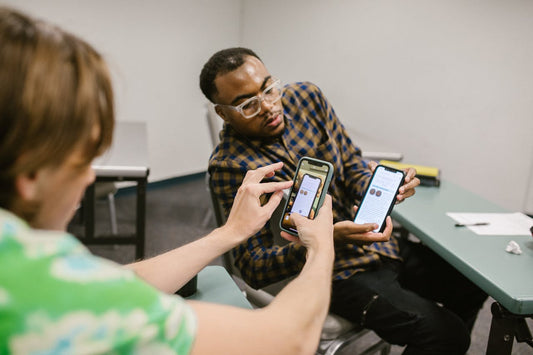 students using phones in classroom 