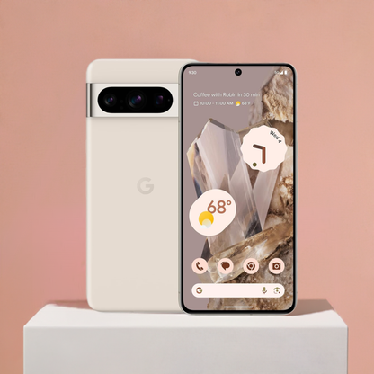 A Kosher Google Pixel 8 Pro smartphone with an AMOLED display and its box against a warm pink background. The phone displays a weather widget and notification for a coffee meeting, emphasizing its sleek, modern design.